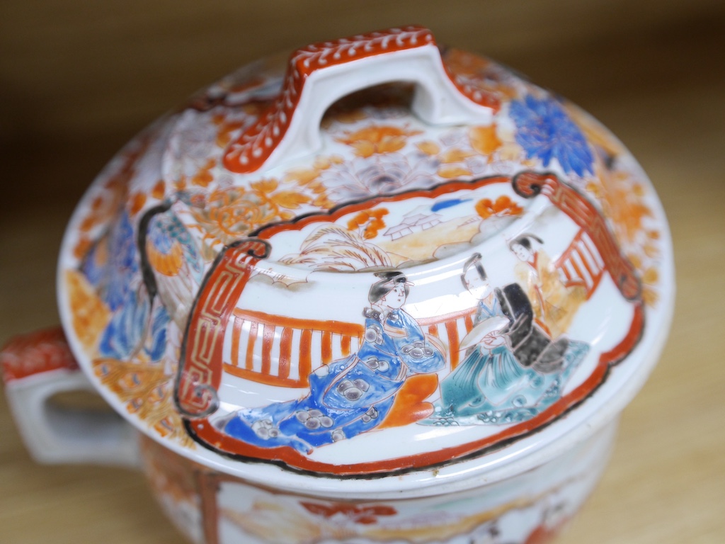 A Japanese porcelain Imari lidded pot, 26cm wide. Condition - fair to good